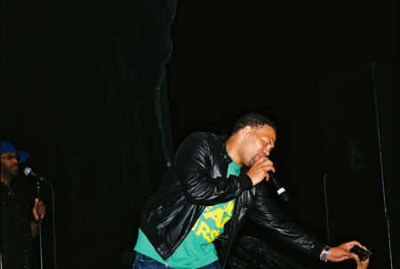 Roberson reaches for a fan's video camera and films himself performing. Photo by Leon Laing.