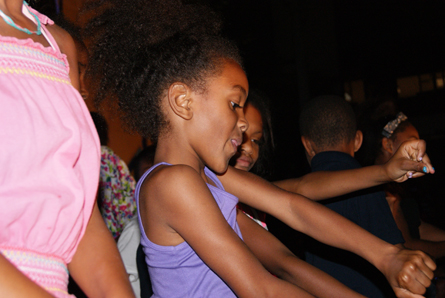A young girl does the Dougie. Photo by Leon Laing.
