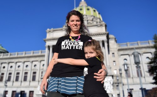 Photo of mother and daughter by Leon Laing.